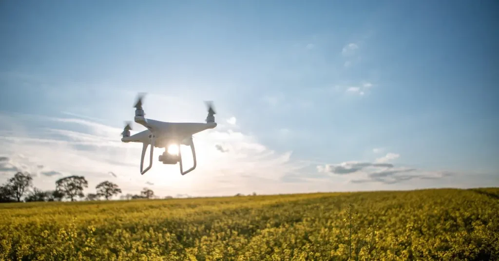 Drone flying over a vast agricultural field for crop monitoring